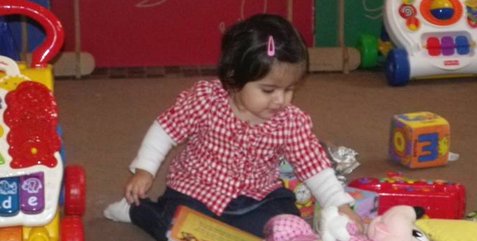 child playing in nursery